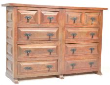 A 20TH CENTURY HARDWOOD MERCHANTS CHEST OF DRAWERS