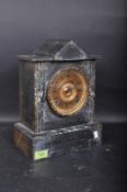 A Victorian 19th century slate and marble 8-day mantel clock. The clock with gilded face having