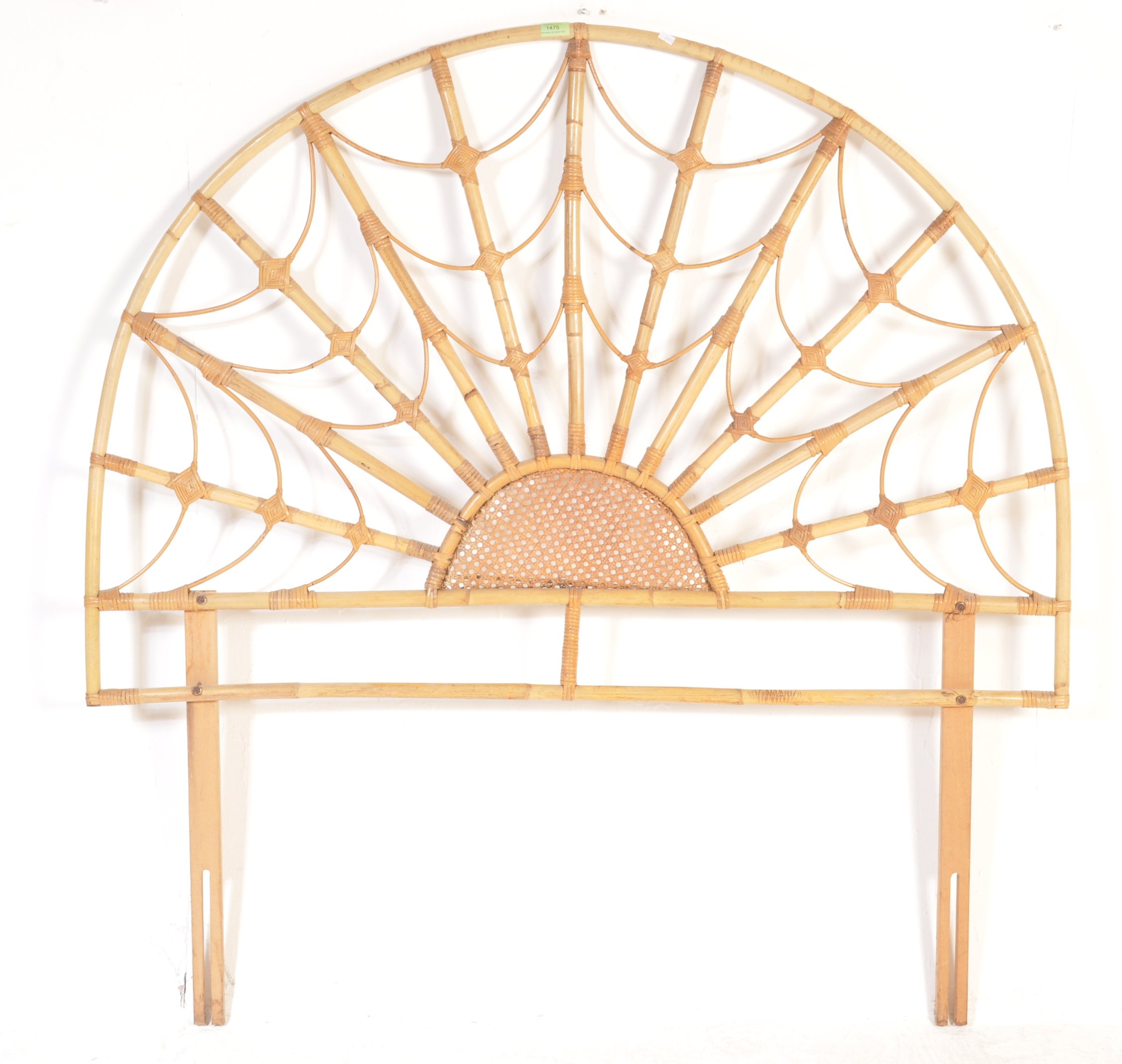 A mid-century retro bamboo headboard. The headboard of bamboo and rattan weave construction being of