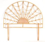 A mid-century retro bamboo headboard. The headboard of bamboo and rattan weave construction being of