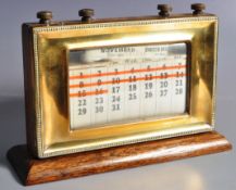 ART DECO OAK AND BRASS FRAMED DESKTOP CALENDAR