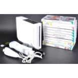 NINTENDO WII CONSOLE, CONTROLLERS AND A COLLECTION OF GAMES