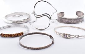 SIX SILVER BANGLE BRACELETS