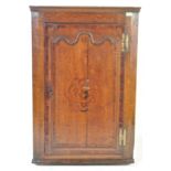 AN 18TH CENTURY GEORGE III OAK CORNER CUPBOARD