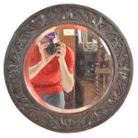 1912 OAK CARVED FRAME CIRCULAR WALL MIRROR