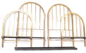 TWO EARLY 20TH CENTURY BRASS AND IRON SINGLE BEDS