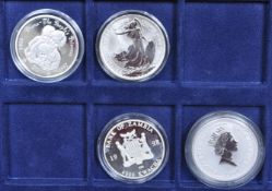 COLLECTION OF FOUR SILVER COINS