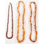 THREE AMBER BEADED NECKLACES