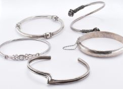 FIVE SILVER BANGLE BRACELETS