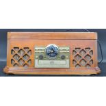 A contemporary vintage revival wooden cased hi-fi stereo system having decorative facia dials with