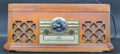A contemporary vintage revival wooden cased hi-fi stereo system having decorative facia dials with