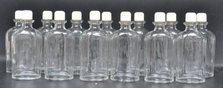 COLLECTION OF THIRTEEN VINTAGE ART DECO HARRODS BOTTLES