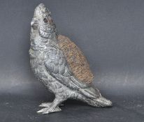 EARLY 20TH CENTURY WHITE METAL PIN CUSHION IN THE FORM OF A BIRD