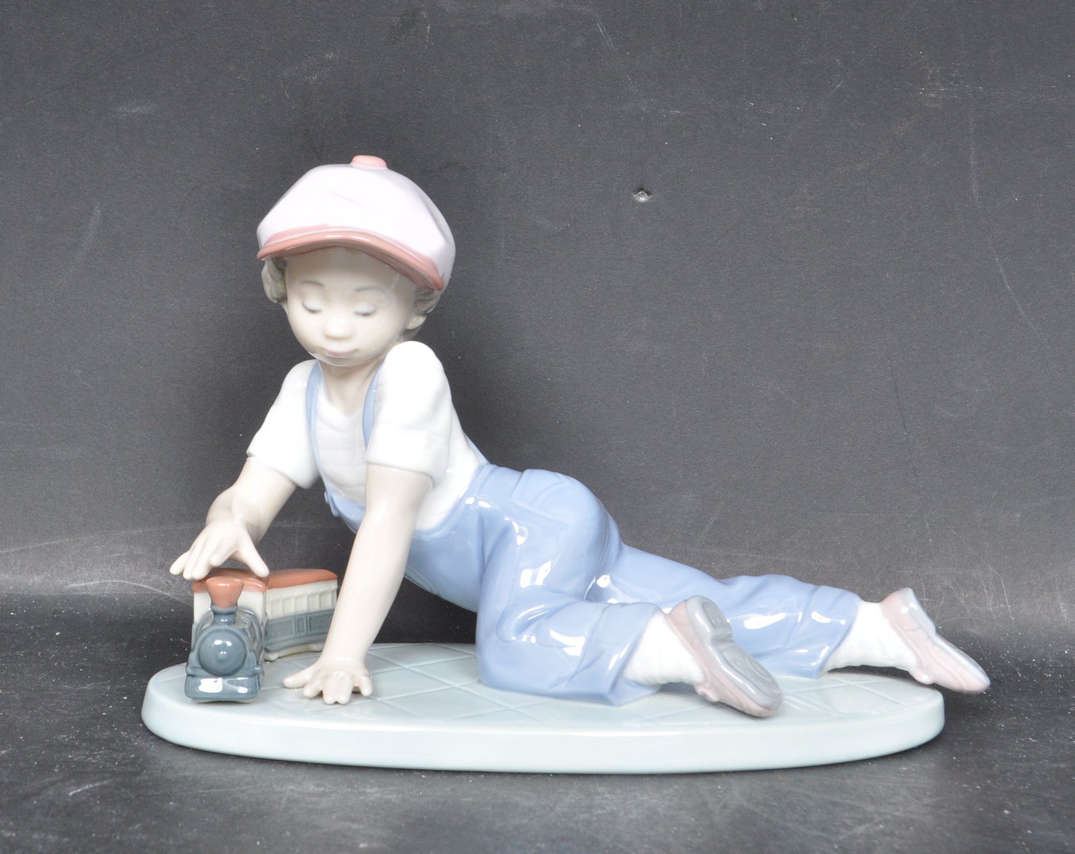 LLADRO COLLECTORS SOCIETY 7619 - 'ALL ABOARD' - CERAMIC PORCELAIN FIGURINE