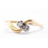 18CT GOLD & DIAMOND 2 STONE CROSSOVER RING