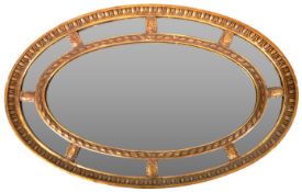 19TH CENTURY VICTORIAN OVAL CUSHIONED GILT GESSO MIRROR