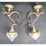 MATCHING PAIR OF ARTS AND CRAFTS BRASS AND GLASS SCONCES