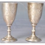 PAIR OF EARLY 20TH CENTURY RUSSIAN SILVER VODKA DRINKING CUPS