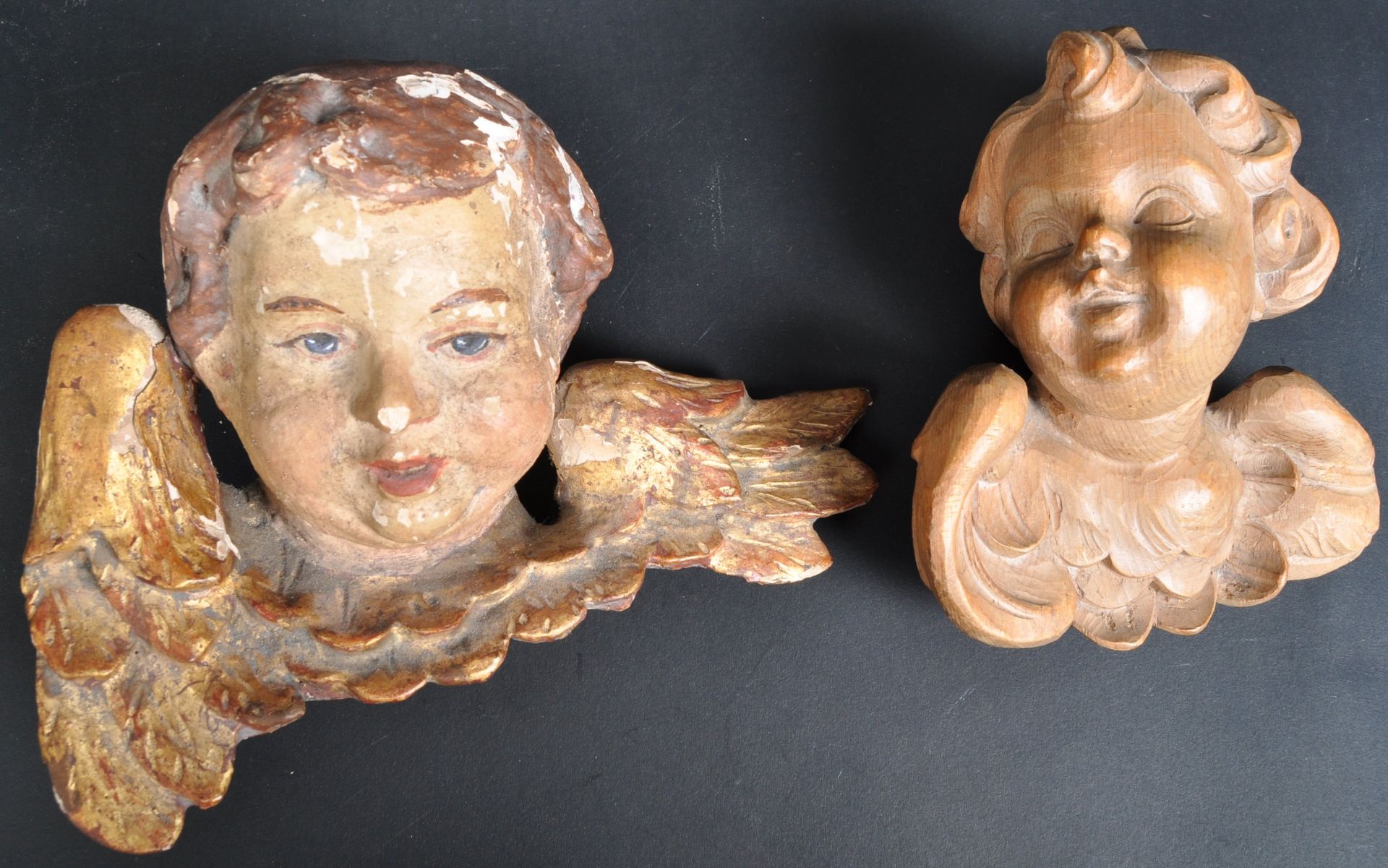 TWO HAND CARVED BACCHANALIAN CHERUBS