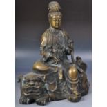 20TH CENTURY BRONZE FIGURE OF GUANYIN ON FOO DOG