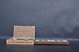 EARLY 20TH CENTURY CRIBBAGE BOARD AND DOMINOS