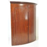 EARLY 19TH CENTURY GEORGE III MAHOGANY CORNER CUPBOARD