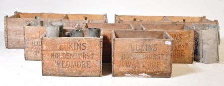 COLLECTION OF SEVEN LUKINS WEDMORE CRATES WITH BOTTLES