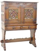 1940'S SPANISH CARVED OAK CUPBOARD WITH PAINTED DETAILING