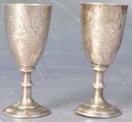 PAIR OF EARLY 20TH CENTURY RUSSIAN SILVER VODKA DRINKING CUPS