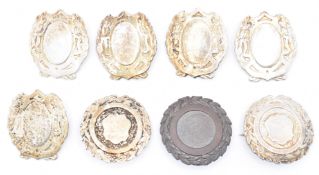 COLLECTION OF SEVEN SILVER PLATED BROOCH BADGES