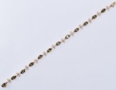 9CT GOLD & TOURMALINE LINE BRACELET