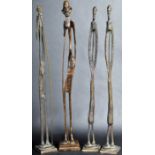 GROUP OF FOUR VINTAGE AFRICAN BRONZE STYLIZED STICK FIGURES