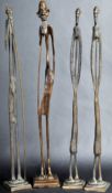 GROUP OF FOUR VINTAGE AFRICAN BRONZE STYLIZED STICK FIGURES