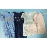 A quantity of 20th century children's clothing, including a hand-smocked blue linen dress retailed