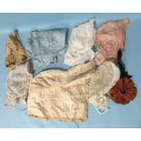 A Victorian silk and lace cap, six bonnets, a silk purse, a quantity of kid gloves and a small