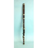 A 19th century rosewood eight-keyed flute, 67cm.