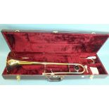A Jupiter brass trombone by KHS Musical Instrument Co. Ltd, in case.