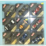 Quartzo, nine cased diecast racing cars, (9).