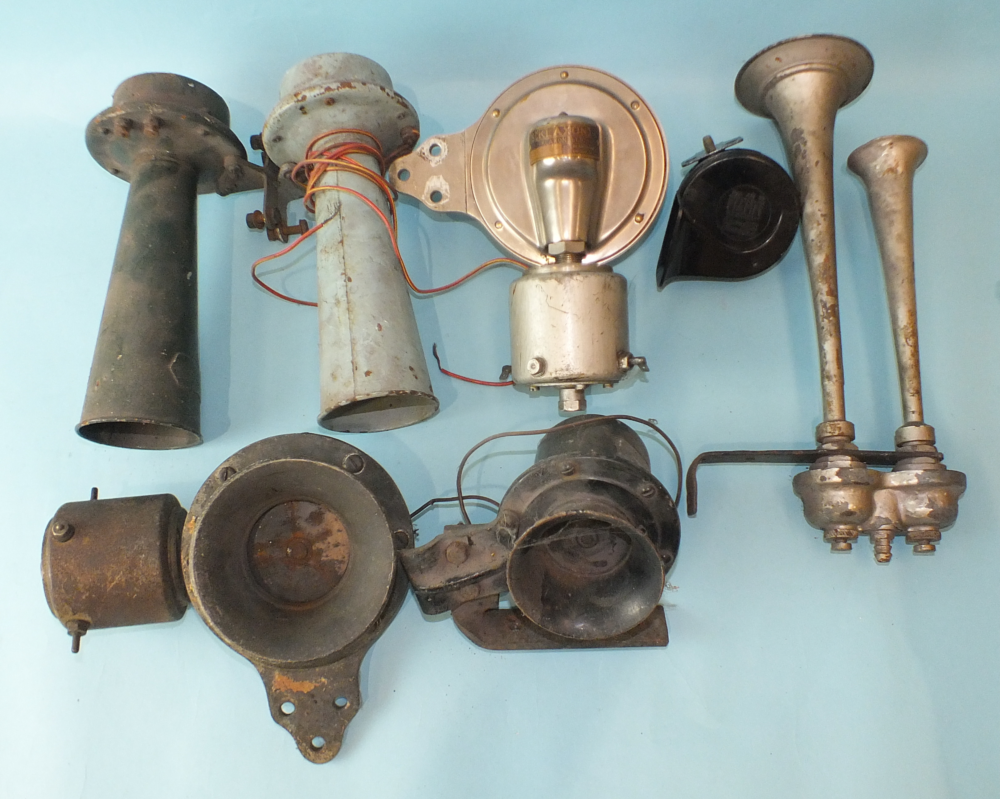 Three vintage Klaxon car horns and four others.