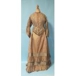 A Victorian hand-stitched brown silk two-piece dress, and two skirts.