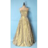 Ricci Michaels, a 1950's lemon/old gold taffeta evening gown, the strapless boned bodice with ruched