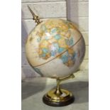 A Replogle Globes Inc 12" diameter globe on brass stand and circular wood base.