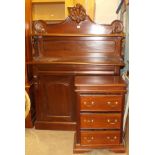 A reproduction mahogany chiffonier with solid shelved back above a pair of panelled doors, 121cm