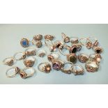 Thirty silver rings, various designs, set marcasite with coloured stones, all marked Silver, gross