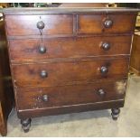 A stained pine rectangular chest of two short and three long drawers on turned legs, 104cm wide.