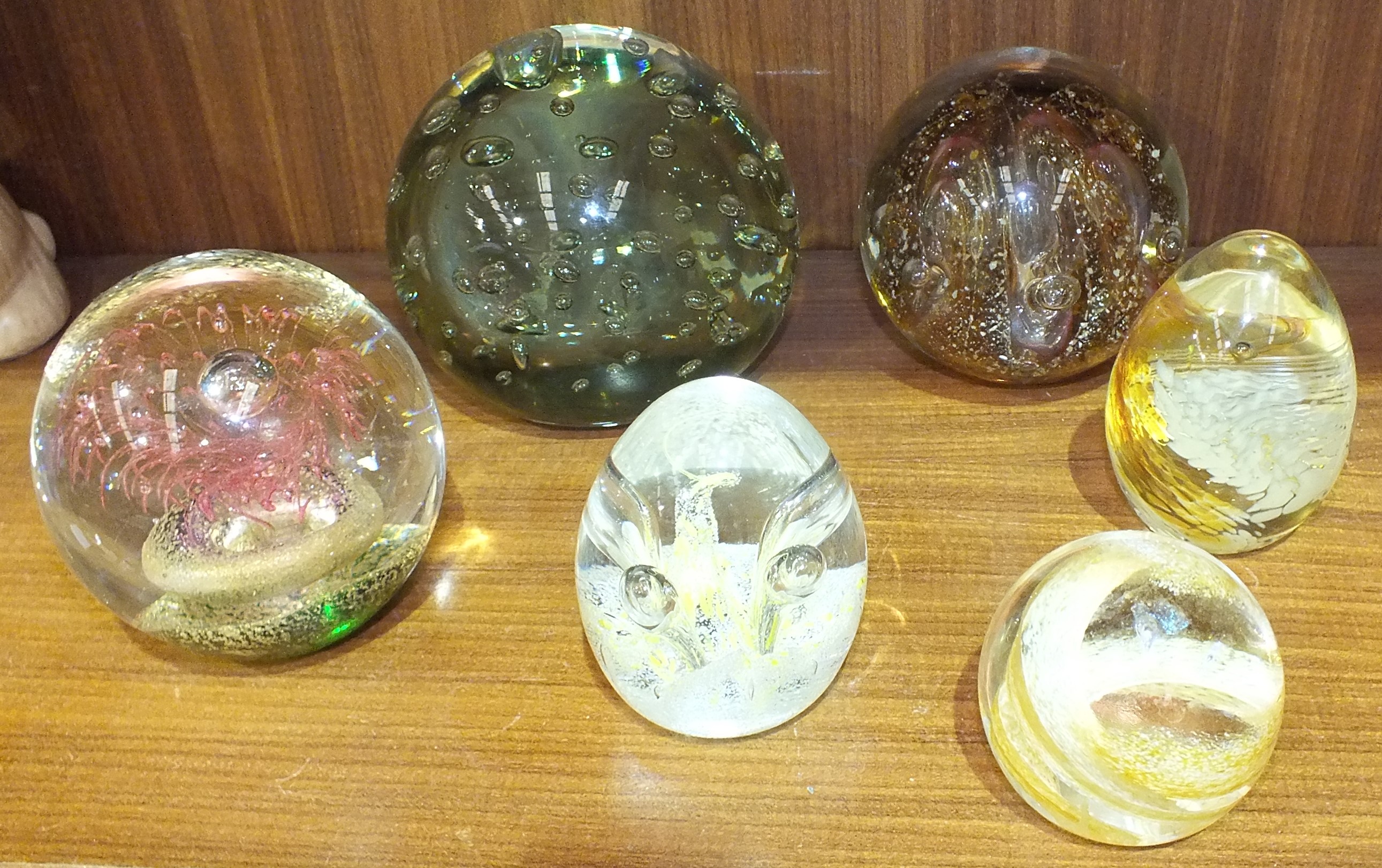 A glass dump paperweight with bubble decoration, 11cm diameter, 9.5cm high, three Caithness glass