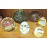 A glass dump paperweight with bubble decoration, 11cm diameter, 9.5cm high, three Caithness glass