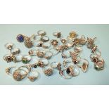 Fifty silver rings, various designs, set marcasite with coloured stones, all marked Silver, gross