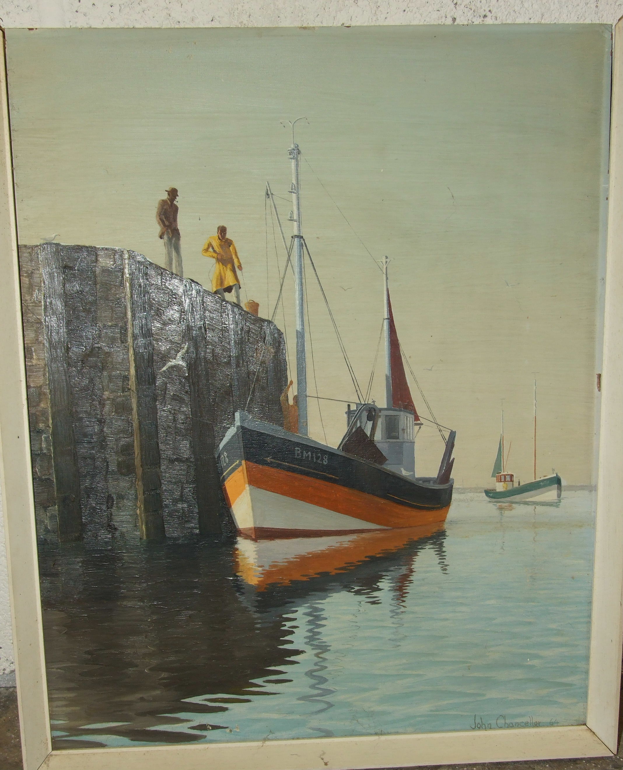 John Chancellor, A FISHING VESSEL BM128 OFF-LOADING ITS CATCH, WITH FIGURES ON QUAY, signed oil on