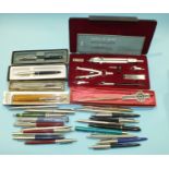 A collection of ball point pens, mainly Parker, an Essel cased geometry set and other items.